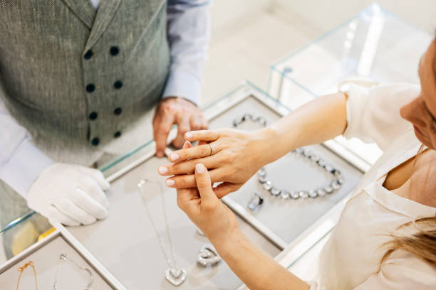 Young attractive woman trying on a diamond ring
